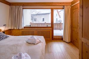 Gulta vai gultas numurā naktsmītnē Albana Hotel Silvaplana