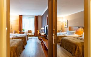 Postel nebo postele na pokoji v ubytování Parkhotel Görlitz