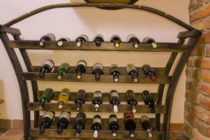 a rack of wine bottles on a wall at Dobranić - Kuća za odmor in Sveti Martin na Muri