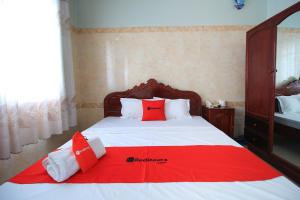 Postel nebo postele na pokoji v ubytování Chin Sao Hotel Nguyen Thi Thap