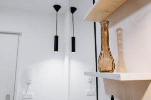 a vase sitting on a shelf in a room at U Zlaté břízy in Horní Blatná
