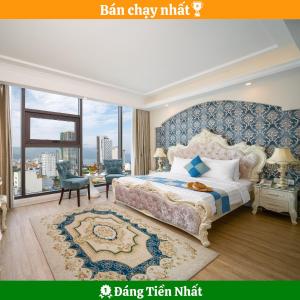een slaapkamer met een groot bed en een groot raam bij Royal Beach Hotel by THG in Da Nang