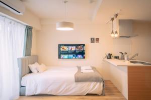 Letto o letti in una camera di 谷町君HOTEL 心斎橋東32