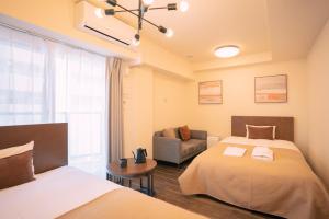 Letto o letti in una camera di 谷町君HOTEL 心斎橋東32