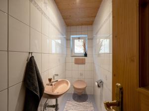 a bathroom with a sink and a toilet at Haus Gletscherblick in Westendorf
