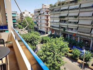 an apartment balcony with a view of a city at Athens Campus Renovated Studio Apartment @ Ilisia in Athens