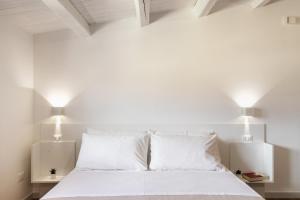 Posteľ alebo postele v izbe v ubytovaní Trisina Rooms