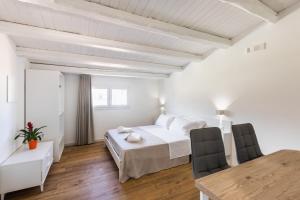 Posteľ alebo postele v izbe v ubytovaní Trisina Rooms