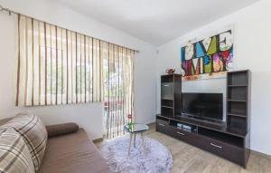 Et tv og/eller underholdning på Villa Mari Apartment