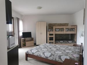 A bed or beds in a room at Pearl Apartments Sozopol