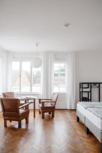a living room with a bed and a table and chairs at Zweitwohnsitz in Drosendorf Stadt