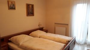 A bed or beds in a room at GRETL - Residence