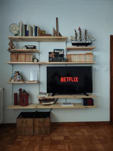 Televízia a/alebo spoločenská miestnosť v ubytovaní a casa da Alicia