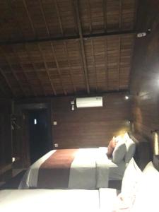 Waterside inn Nusa Penida客房内的一张或多张床位