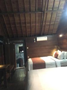 Waterside inn Nusa Penida客房内的一张或多张床位