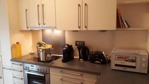 A kitchen or kitchenette at GRETL - Residence