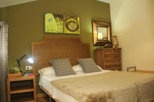 Postel nebo postele na pokoji v ubytování Apartamentos Alcazar de Baeza