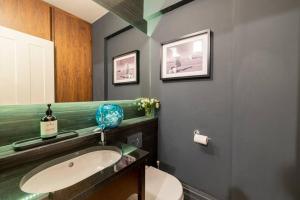 a bathroom with a sink and a toilet at Westcourt by RMG Apartments in Harrogate +27 photos