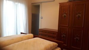 A bed or beds in a room at GRETL - Residence