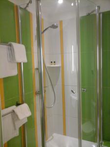 Ванная комната в Hôtel Carmin