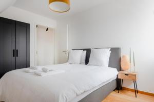 Voodi või voodid majutusasutuse Waterloo Design Residence toas