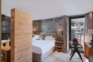 Postel nebo postele na pokoji v ubytování Unique Hotel Post