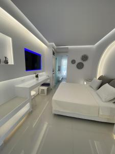 Postel nebo postele na pokoji v ubytování SeaRock Rooms and Suites