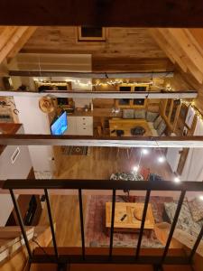 an overhead view of a living room and attic at Starry Laz mountain house in Ravna Gora