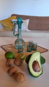 an avocado and nuts on a table with a juicer at Bicorna - Chania in Plaka