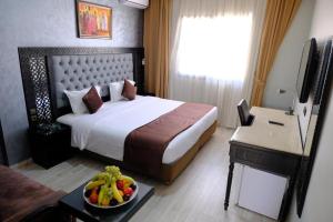 Een bed of bedden in een kamer bij Washington Hotel