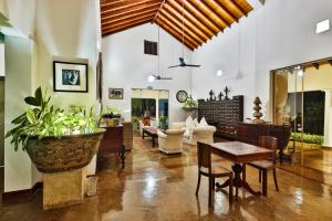 a living room with a couch and a table at Villa Hundira in Negombo