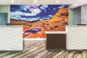 a wall with a mural of a mountain at La Quinta by Wyndham Las Vegas Summerlin Tech in Las Vegas