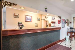 a bar at a restaurant with a phone on the counter at Days Inn by Wyndham Kentland in Kentland