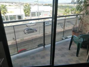 a balcony with a view of a parking lot at Apartamento Pepe in Alcantarilla