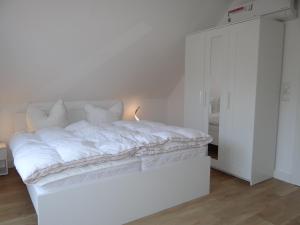 Katil atau katil-katil dalam bilik di Ferienanlage Haus hinter den Dünen App 10 DG 2