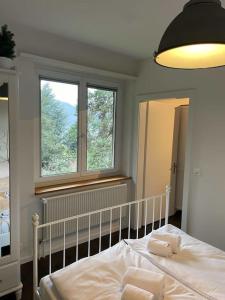 Ένα ή περισσότερα κρεβάτια σε δωμάτιο στο Beautiful flat with nice lake and mountain views