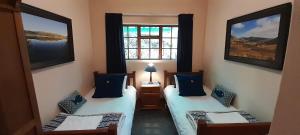 Katil atau katil-katil dalam bilik di Touraco