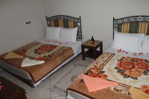 Postel nebo postele na pokoji v ubytování Riad Marrakech Medina