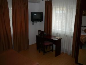 Een TV en/of entertainmentcenter bij Casa iRMA - Rooms for rent
