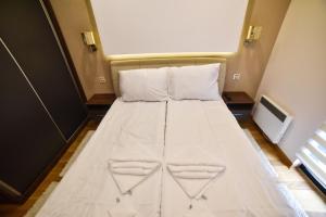 Ένα ή περισσότερα κρεβάτια σε δωμάτιο στο Apartman S1-2