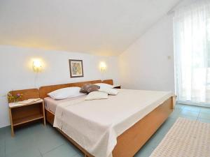 Postel nebo postele na pokoji v ubytování Apartments Bruno
