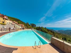 a swimming pool with a view of the ocean at Casa ESTELLA in Magliolo
