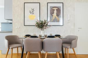 a dining room with a table and chairs at Business & Family Ambiente Apartments in Bratislava