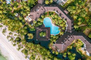 an aerial view of a mansion with a swimming pool at Diani Reef Beach Resort & Spa in Diani Beach