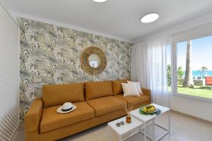 a living room with a couch and a table at Chalet Santa Ana 2 by VillaGranCanaria in Playa del Ingles