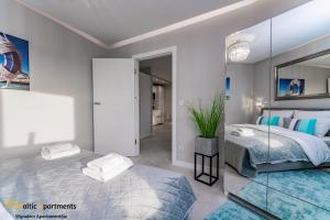 Łóżko lub łóżka w pokoju w obiekcie Baltic Apartments - Sun Towers
