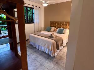 Cama ou camas em um quarto em Pousada Paloma
