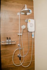a shower with a shower head in a bathroom at Ao Luek Panoramic Pool-SHA Plus in Ao Luk