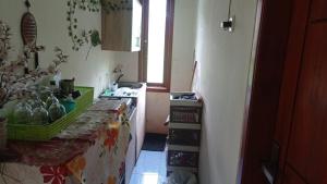 a kitchen with a sink and a counter top at CALDERA PARK HOMESTAY Syariah in Probolinggo