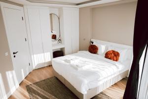 a bedroom with a bed with pumpkins on it at Bolahenk Suites in Istanbul